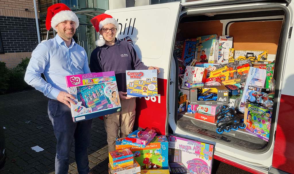 Churchill Colleagues Darren Ridler and Nick White load up presents for Mission Christmas appeal 